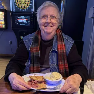 Mom &amp; her Rueben. We took that half home. Big servings happen here.