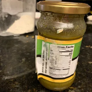 a jar of pesto sauce