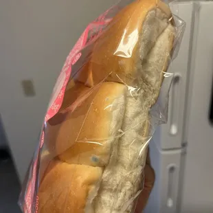 a sandwich wrapped in plastic