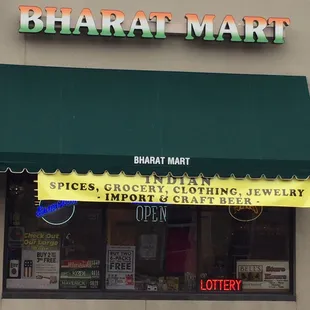 a storefront with a green awning