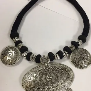 Different color thread and silver pieces