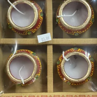 a box of four tea lights