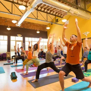 Yoga classes in a large open studio space