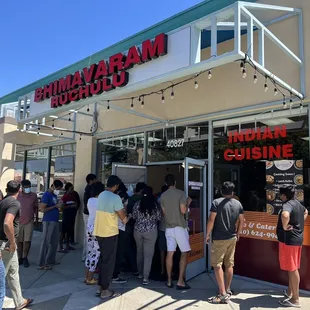 people outside a restaurant