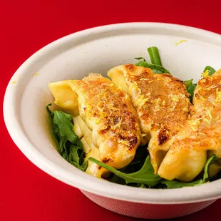 a bowl of food on a red table