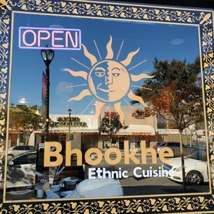 a sign in the window of a restaurant