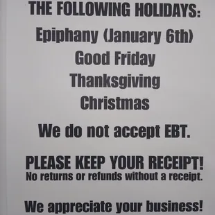 a sign stating to be closed on the following holidays