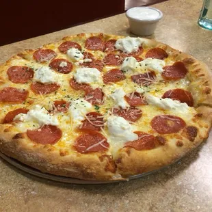 White pizza with pepperoni