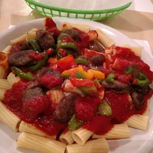 a plate of pasta with meat and vegetables