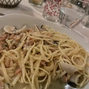Watery over cooked noodles in greasy oil with smelly clams on it, it&apos;s supposed to be linguine with clams