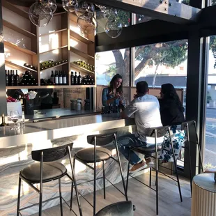 two people sitting at the bar
