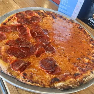 Half cheese and half pepperoni pizza