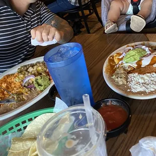 Left: chicken friend steak topped with green chile. Right: Chilaquiles with eggs (over easy)