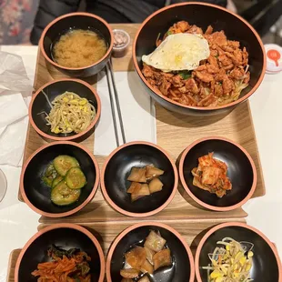 a variety of asian food in bowls