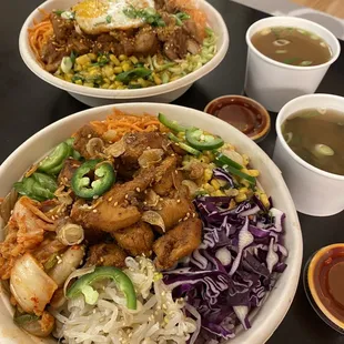 Spicy chicken bowl (front), firecracker pork bowl (back), signature red sauce, &amp; miso soup