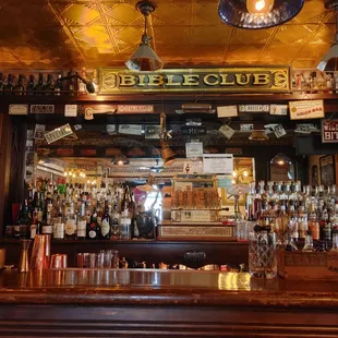 a bar with a lot of bottles of alcohol