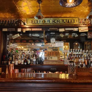 a bar with many bottles of alcohol