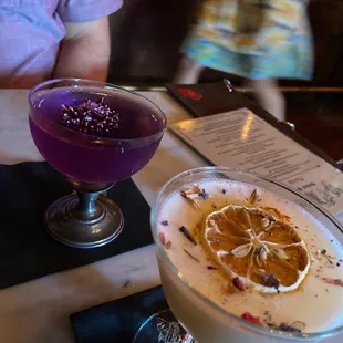 two cocktails on a table