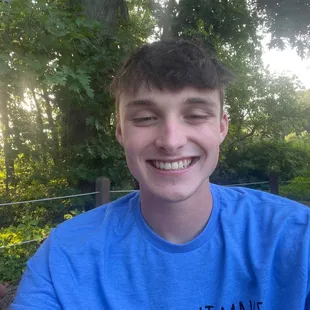 a boy with a donut in his mouth