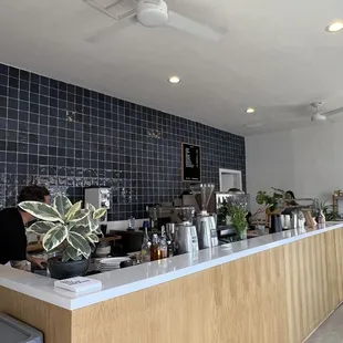 a man working at a coffee shop