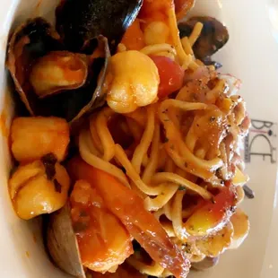 a bowl of pasta and clams