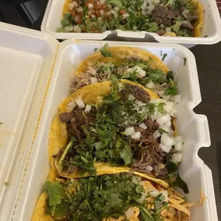 three tacoss in a styrofoam container
