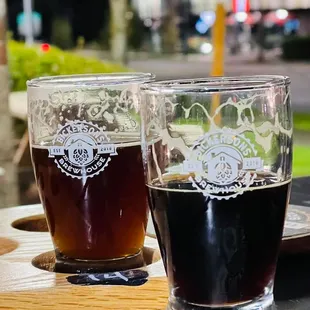 two glasses of beer on a table