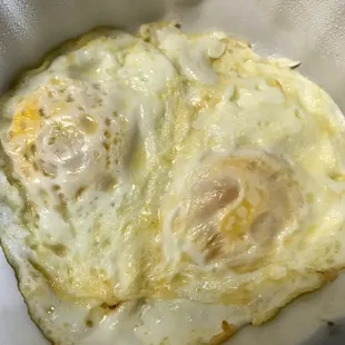 two fried eggs in a basket