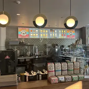 a coffee shop counter with a variety of items