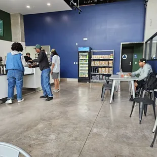 Coffee roasting to the right, order counter to the left with seating choices between