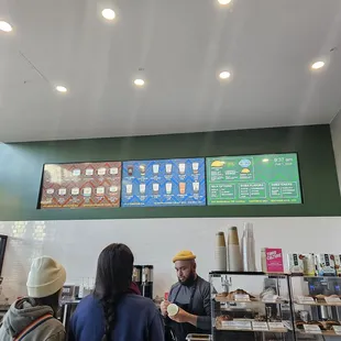 menus on the wall above the counter