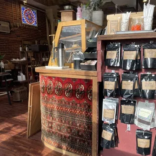 a coffee shop with a variety of bags of coffee