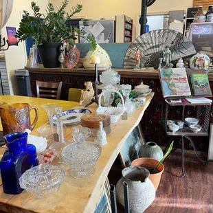 a table with vases and other items