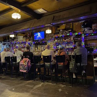 people sitting at a bar