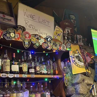 a shelf of liquor bottles