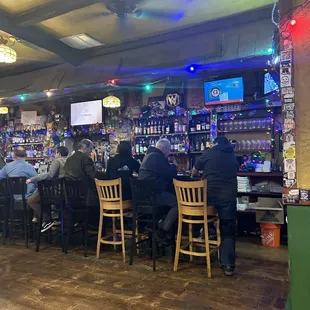 people sitting at a bar