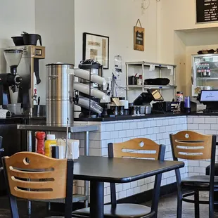a coffee shop with tables and chairs