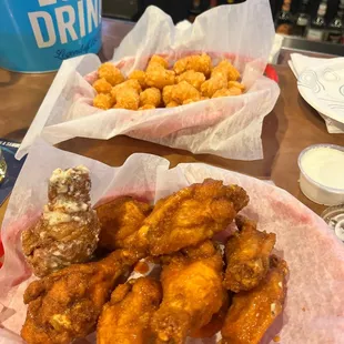 Garlic Parm and Buffalo chicken wings.  Breaded, extra crispy.  Tots.