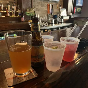 a variety of beverages on a bar