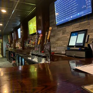 a bar with a large screen tv