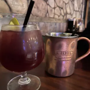 a drink and a mug on a table