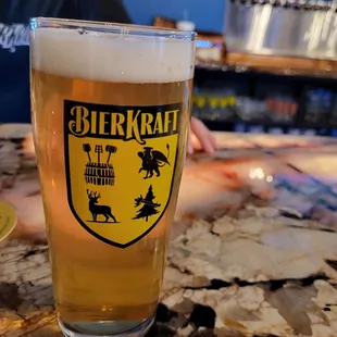 a glass of beer on a table