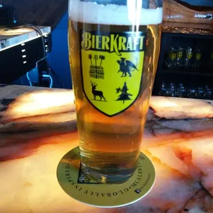 a glass of beer on a table