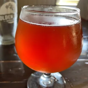 a glass of beer on a table