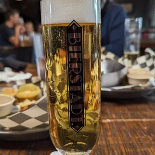 a glass of beer on a table