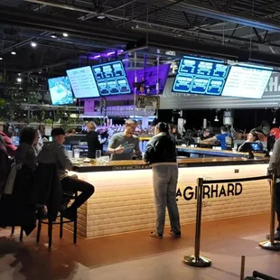 a crowd of people at a bar