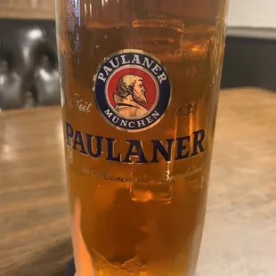 a pint of beer on a table