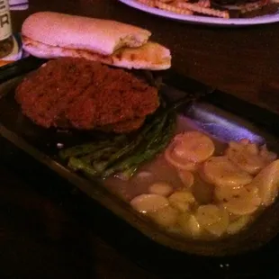 Weiner schnitzel with asparagus and German potato salad.