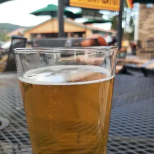 a glass of beer on a table