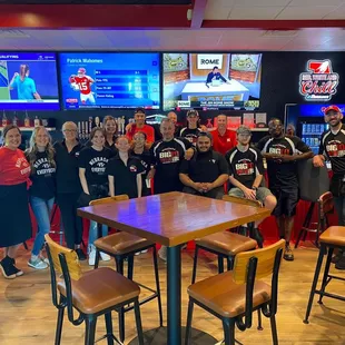 a large group of people posing for a picture